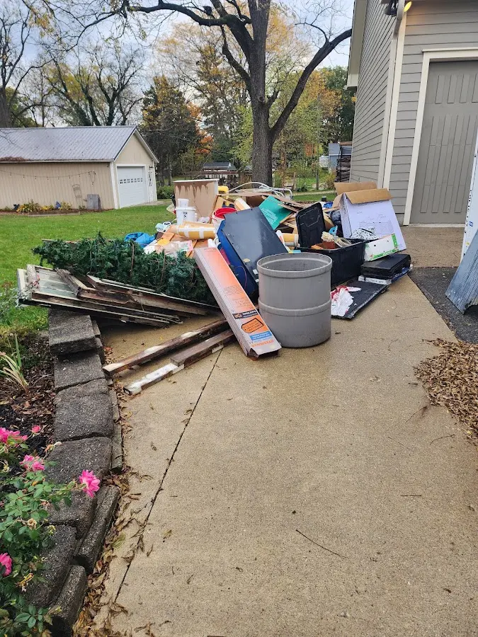 Dumpster being loaded with debris for Roofing Dumpster Rental in Salina